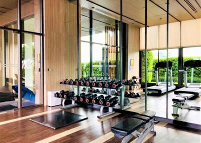 Modern gym with equipment and large mirrors