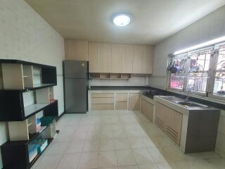 Spacious kitchen with modern appliances and ample storage