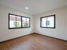 Bright and spacious empty bedroom with large windows