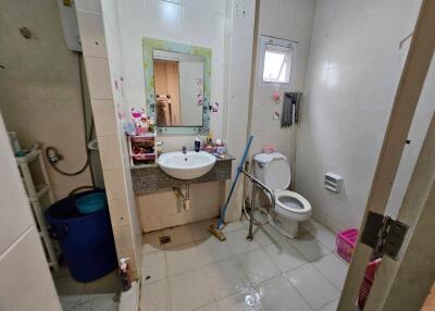 Bathroom with toilet, sink, and shower