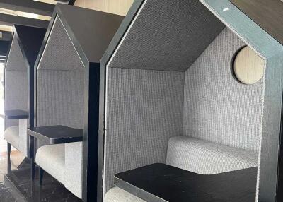 cozy seating booths with tables in a common area