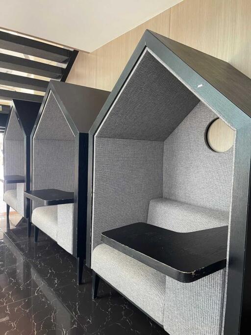 cozy seating booths with tables in a common area