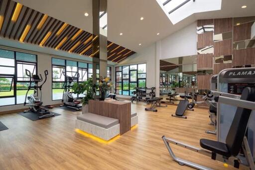 Spacious and modern fitness center with equipment and large windows