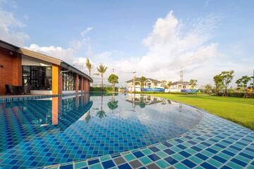 Modern outdoor swimming pool with landscaping