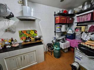 A well-organized kitchen with cooking essentials and storage