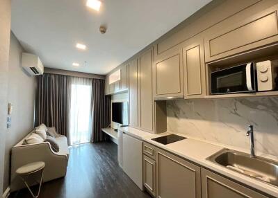 Modern living area with built-in kitchenette