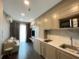 Modern living area with built-in kitchenette