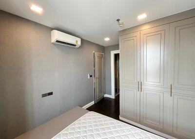 Bedroom with large wardrobe and air conditioning