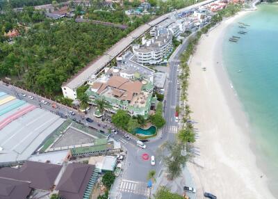 Aerial view of beachfront properties and surrounding area