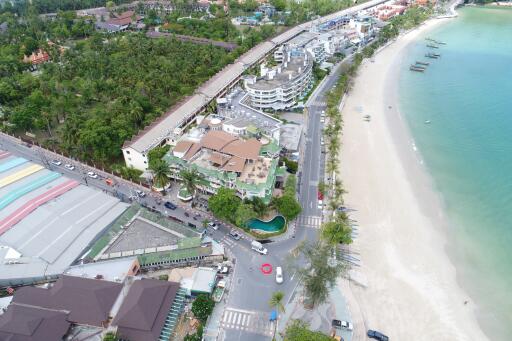 Aerial view of beachfront properties and surrounding area