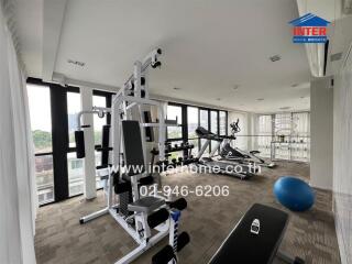 In-house fitness center with modern gym equipment and city views