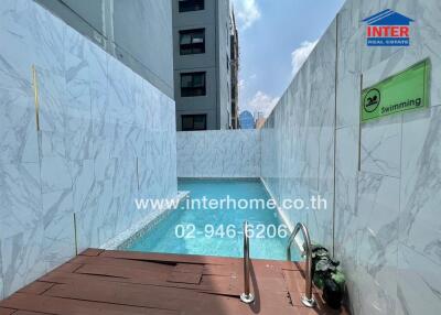 Outdoor swimming pool with modern design and deck area