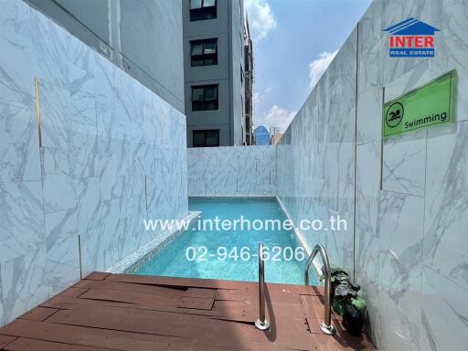 Outdoor swimming pool with modern design and deck area