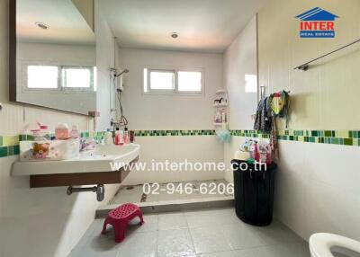 Clean, bright bathroom with large mirror