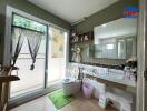 Bathroom with glass door and vanity