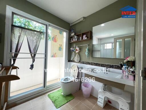 Bathroom with glass door and vanity