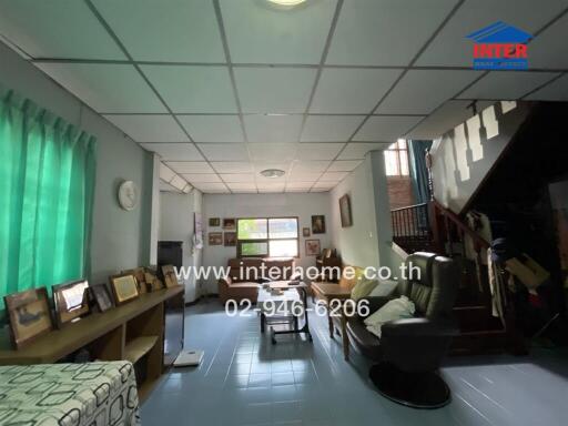 Living room with seating area and staircase