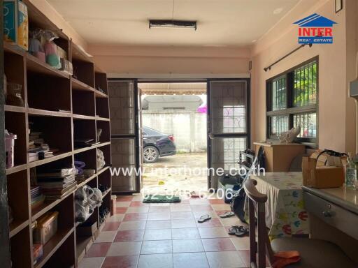 Compact workspace with ample shelving and natural light