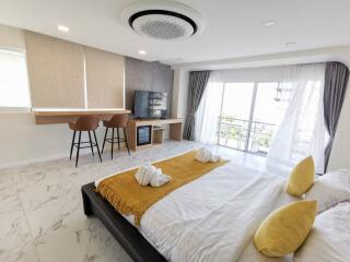 Bright and modern bedroom with balcony