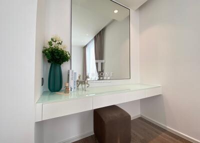 vanity table with large mirror in bedroom