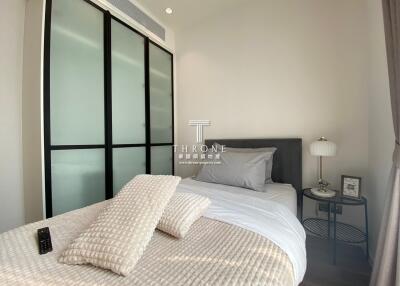 Modern bedroom with frosted sliding door wardrobe