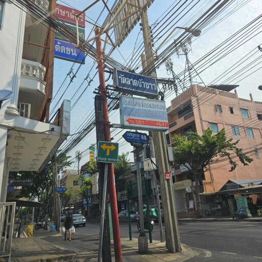 urban street with various signs and buildings