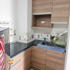 Modern kitchen with wooden cabinets and countertop