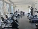 spacious modern gym with various exercise equipment