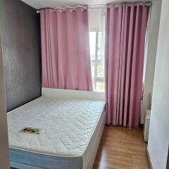 Bedroom with bed and pink curtains