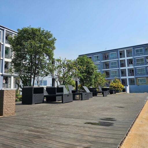 Outdoor common area with seating and greenery