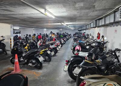 Indoor parking garage with multiple parked motorcycles
