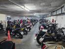 Indoor parking garage with multiple parked motorcycles