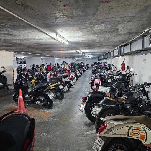 Indoor parking garage with multiple parked motorcycles