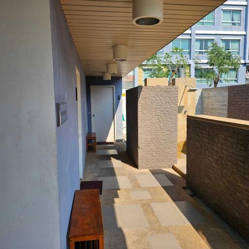 Outdoor corridor with seating area