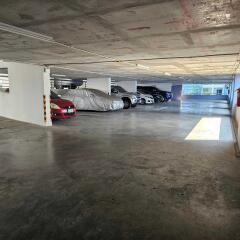 Indoor parking garage with several parked cars