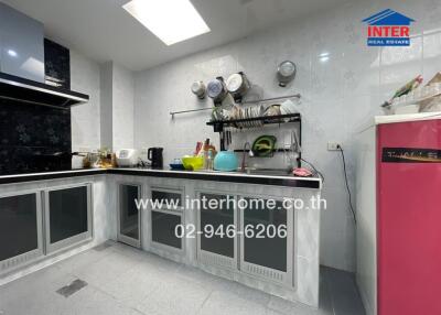 Modern kitchen with stainless steel counters and appliances