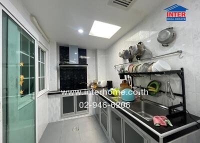 Modern kitchen with appliances and dish rack