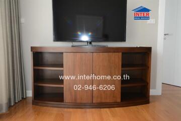 Living room with TV and wooden cabinet