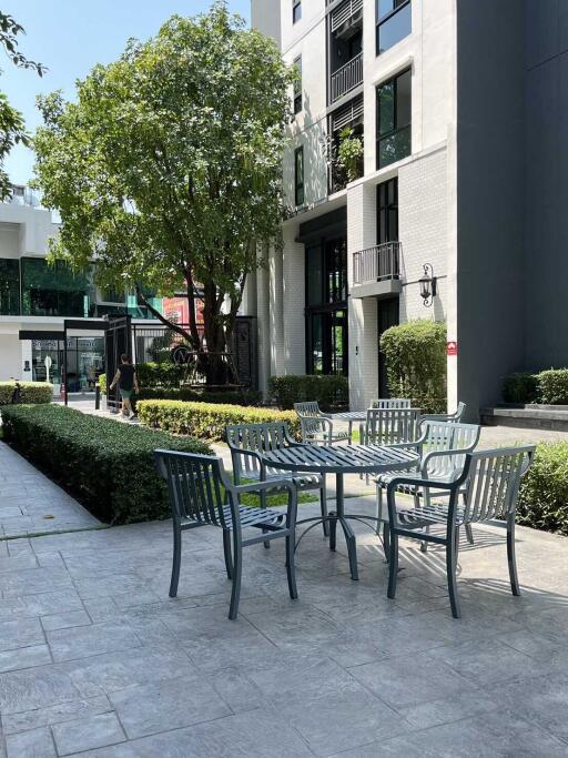 Modern apartment outdoor area with seating