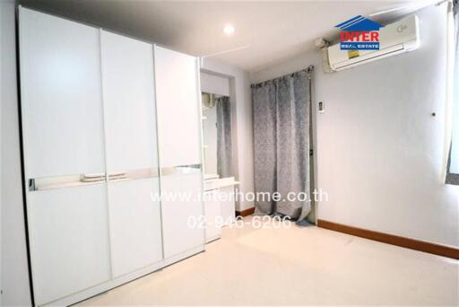 Bedroom with wardrobe and air conditioning