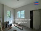 Unfurnished room with windows and painting supplies