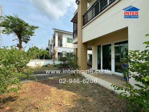 Front view of a modern house with garden