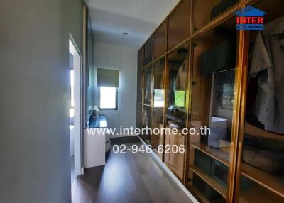 Bedroom hallway with wardrobe and window