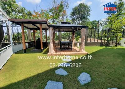Outdoor living space with gazebo and lawn