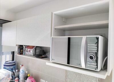 Modern kitchen with microwave and storage