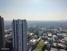 Aerial view of a high-rise apartment building surrounded by a cityscape