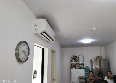 Living area with air conditioner and refrigerator