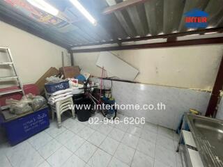 Utility room with storage and cleaning supplies