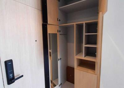 Open closet with various shelves and compartments