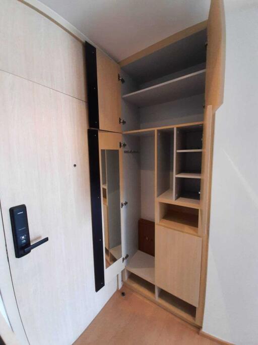 Open closet with various shelves and compartments